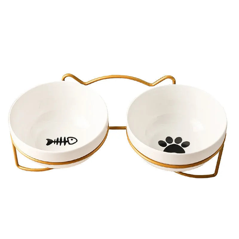 White ceramic pet bowl with cat paw print in a black iron stand with cat ear details