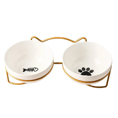 White ceramic pet bowl with cat paw print in a black iron stand with cat ear details