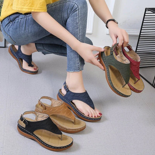 Comfortable women's wedge sandals in various colors with adjustable straps and a lightweight sole