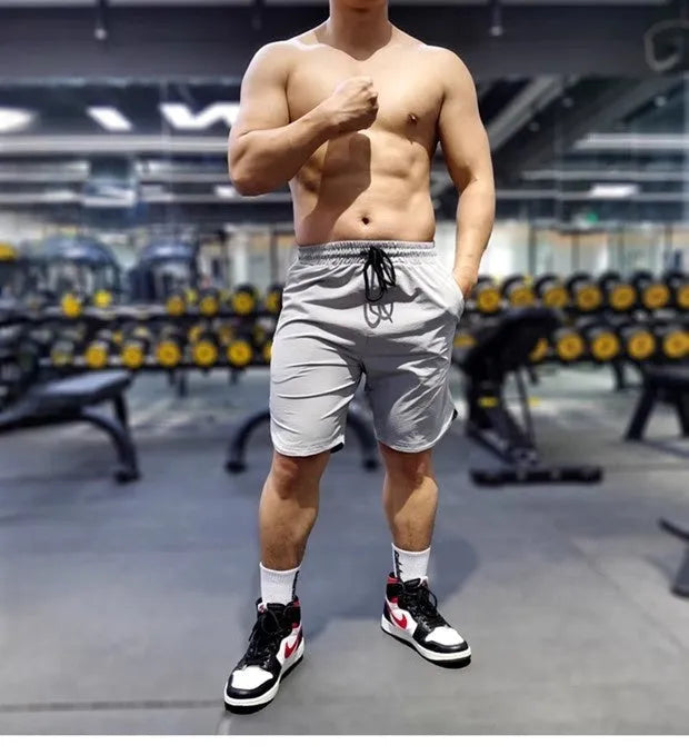 Men's quick-dry running shorts in polyamide-spandex blend fabric shown in black, blue and grey colour options
