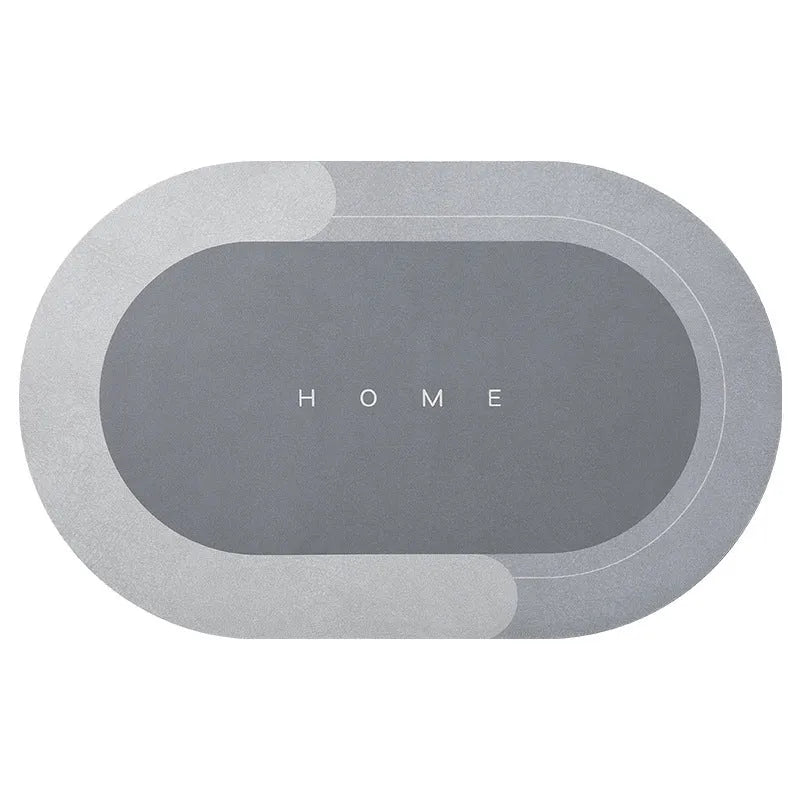 Oval diatomite bathroom floor mat in blue with natural rubber non-slip backing on tiled floor.