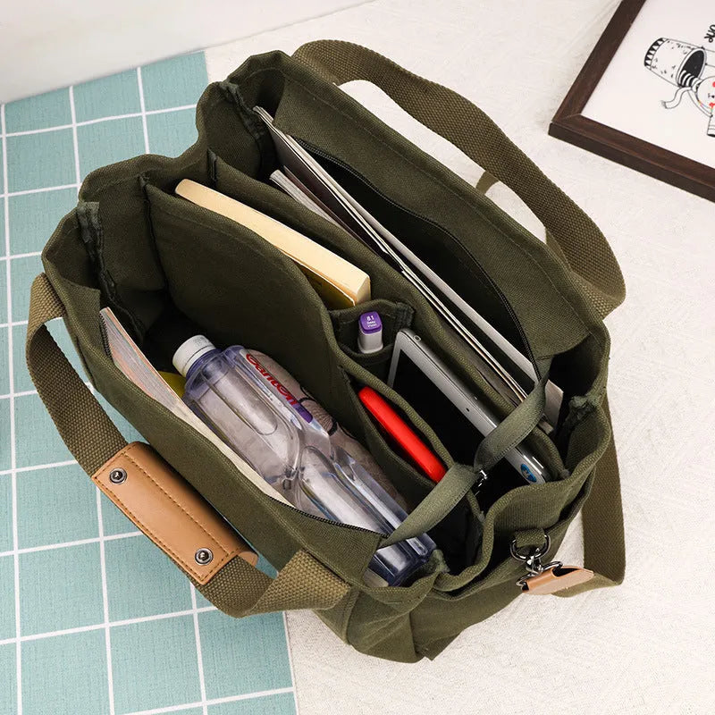 Large canvas tote bag in horizontal square shape with open-zip sides and internal organisers