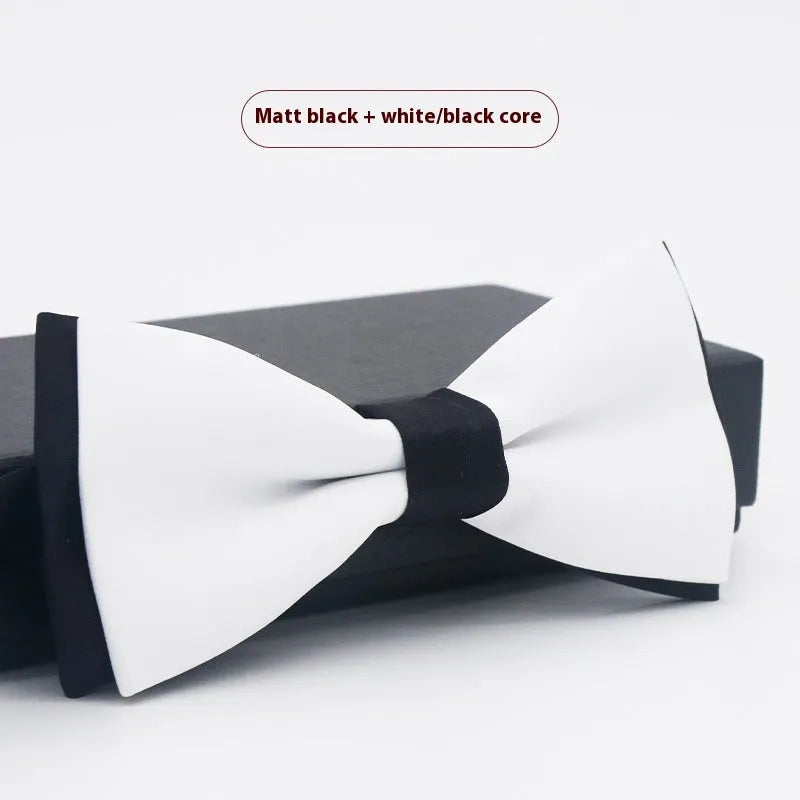 A solid colour pre-tied bow tie with an adjustable neck strap, shown in a classic flat head shape.