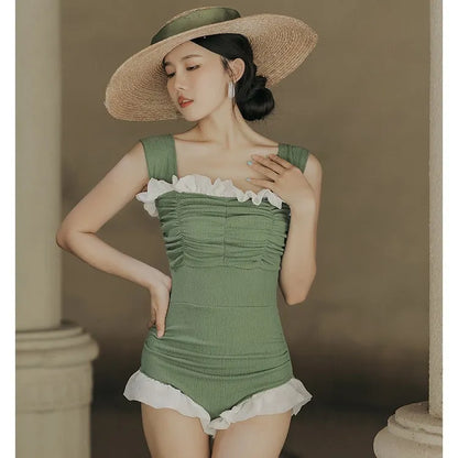 Women's black high-waisted one-piece swimsuit made from quick-drying polyester fabric.