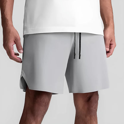Men's seamless grey sports shorts in straight leg, knee-length quick-dry polyester design.