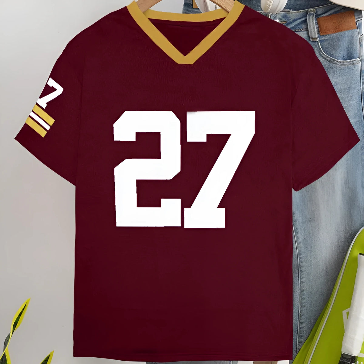 Red loose fit cotton t-shirt with white printed letters and short sleeves.