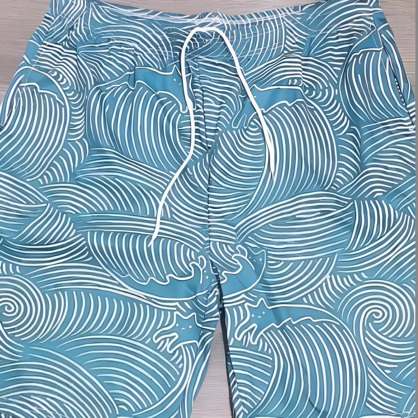 Loose blue sports shorts with 3D geometric pattern printing on the fabric.