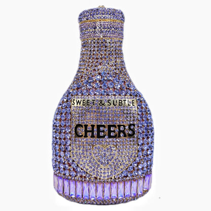 Gold hard-shell clutch bag shaped like a champagne bottle with a synthetic leather interior.