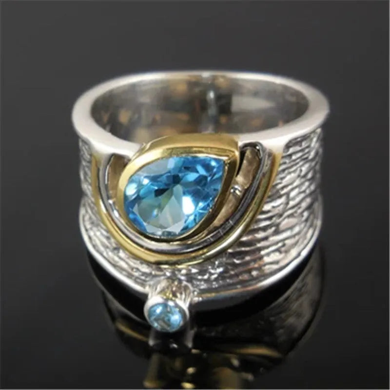 Creative Chinese style inlaid blue rhinestone zircon ring with drop shape design in five standard ring sizes for women, featuring intricate alloy setting and vibrant blue F344 colouration
