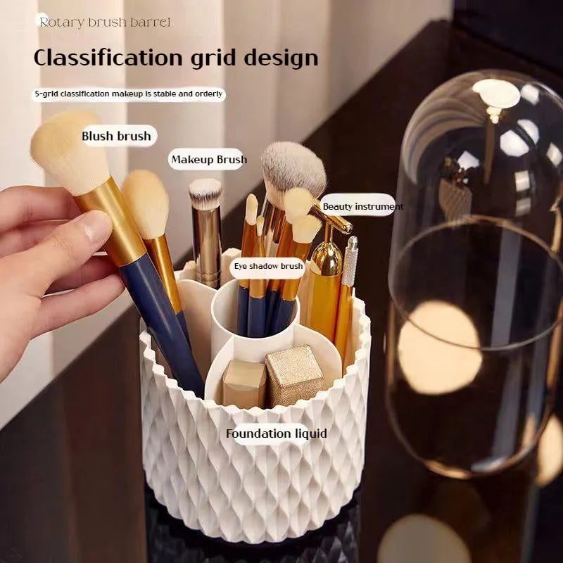 White rotating acrylic makeup brush holder with transparent dustproof lid on a desktop.
