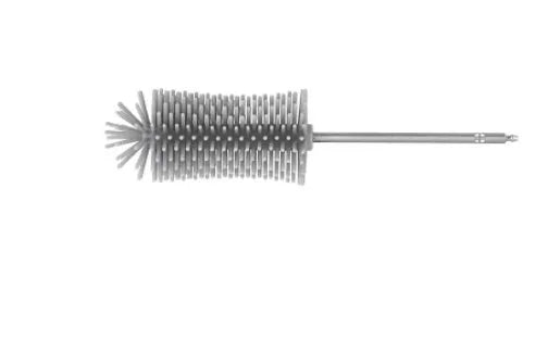 Green electric cleaning brush with multiple brush heads on a kitchen worktop.