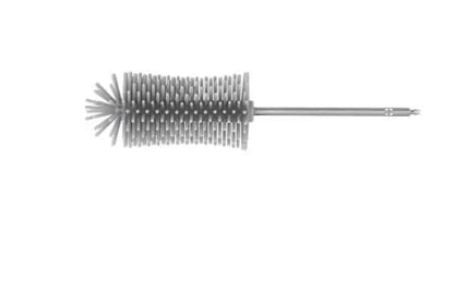 Green electric cleaning brush with multiple brush heads on a kitchen worktop.