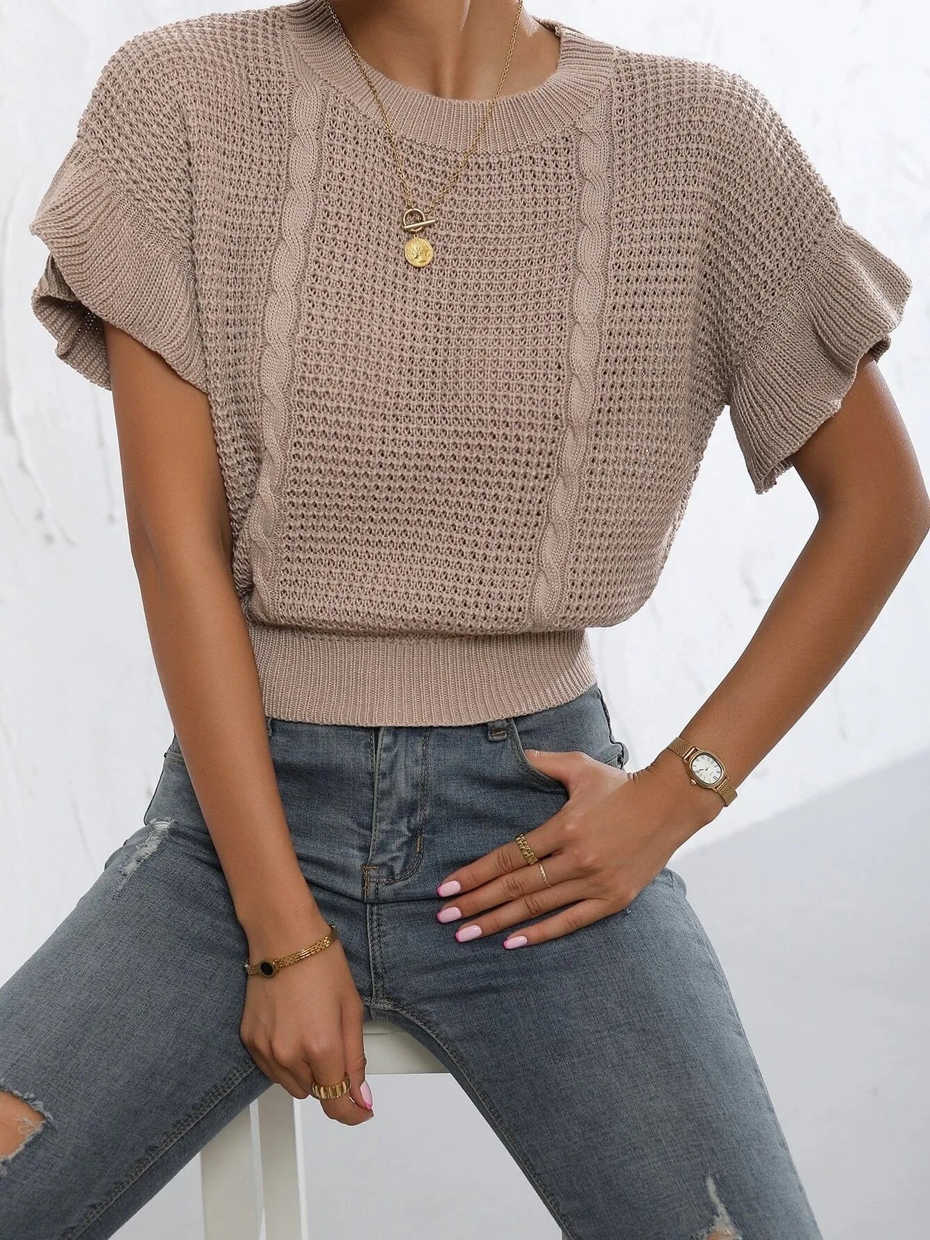 Loose round neck knitted pullover sweater with twisted string ruffled short sleeves in dark brown.