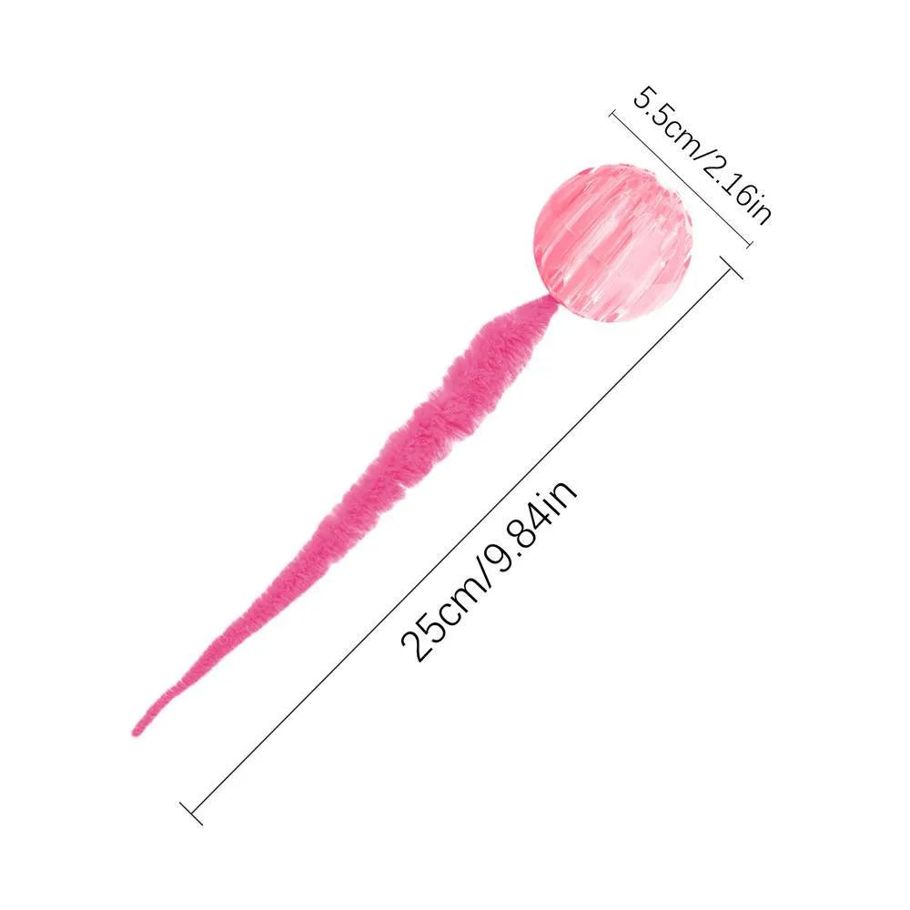 Green interactive cat toy with a bouncy ball and a long worm-shaped tail on a plain background.