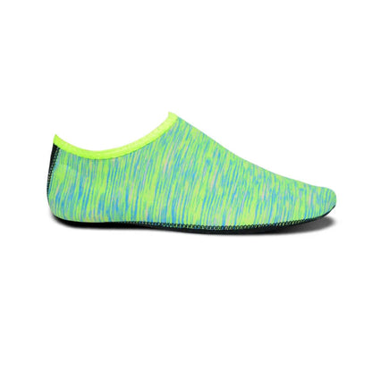 Pair of snorkeling diving socks in camouflage red, 2.5mm rubber and Lycra, non-slip sole, shown flat.