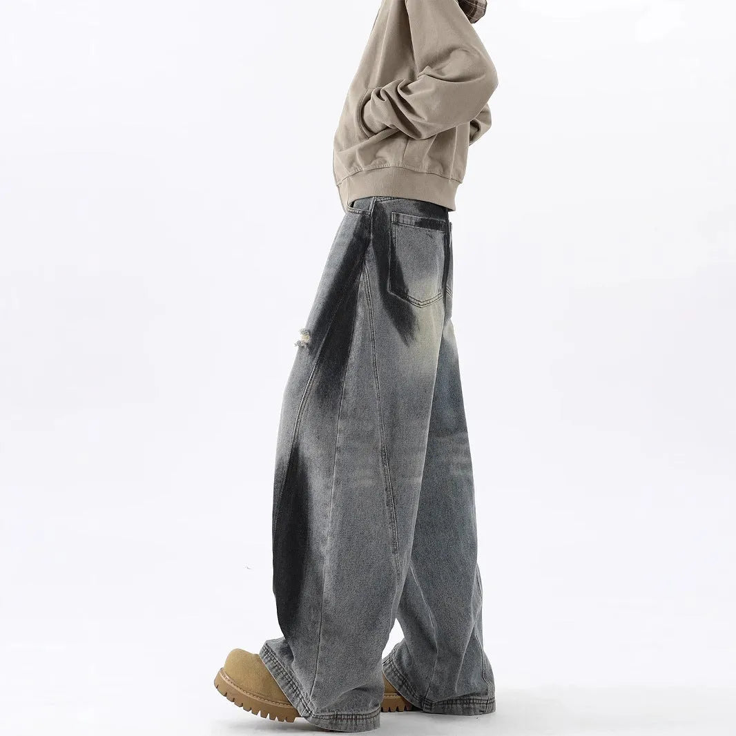 Men's blue ripped jeans with splash-ink distressing and loose fit