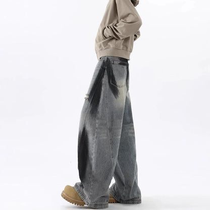 Men's blue ripped jeans with splash-ink distressing and loose fit