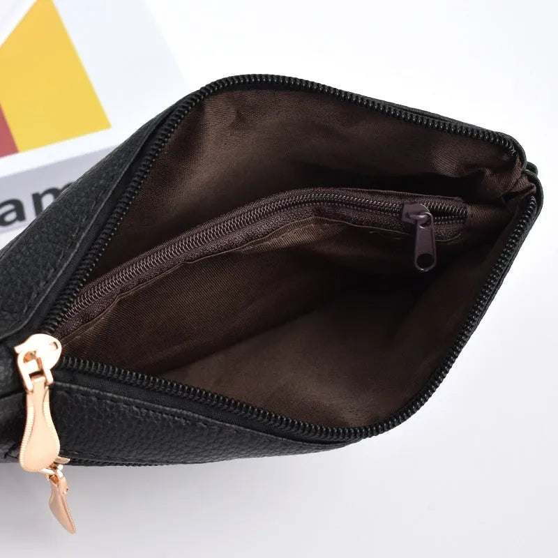 Soft surface square PU crossbody bag and clutch with internal zipper pocket in various colours.