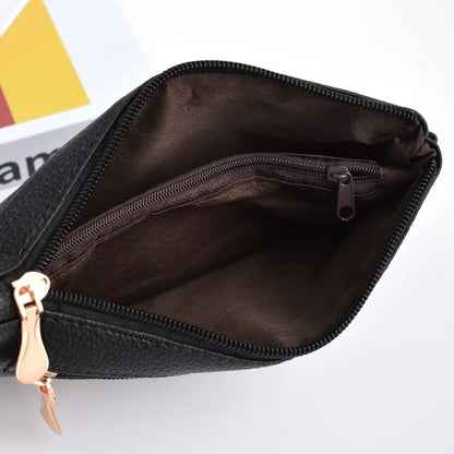 Soft surface square PU crossbody bag and clutch with internal zipper pocket in various colours.
