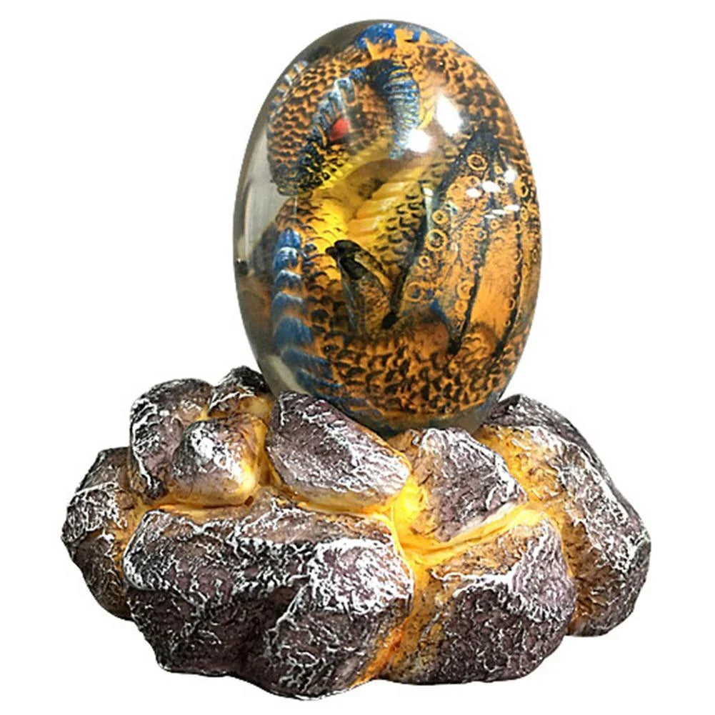 A lifelike resin dragon egg ornament with a crystal-clear, transparent design, sitting on a glowing lava-style base.