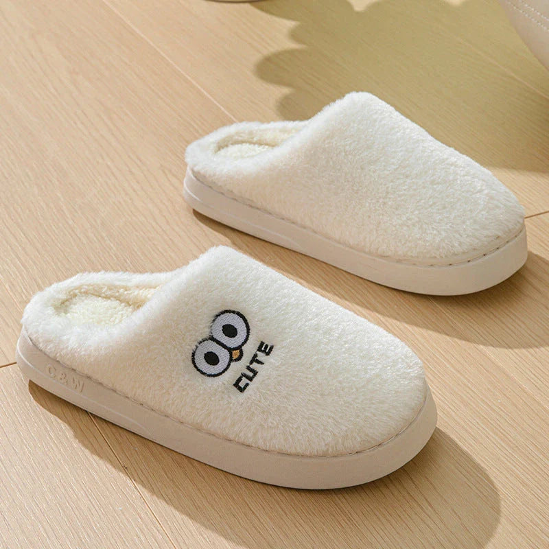 Stylish and cozy cartoon-inspired slippers with plush material and non-slip rubber soles, perfect for keeping feet warm and comfortable at home.