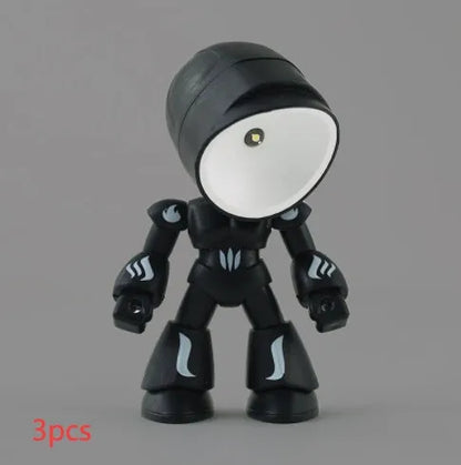 Mini mecha robot hero LED night light with adjustable arms on a desk.