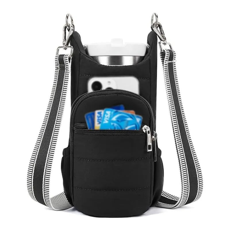 Black cloth water bottle carrier bag mounted on bicycle handlebars
