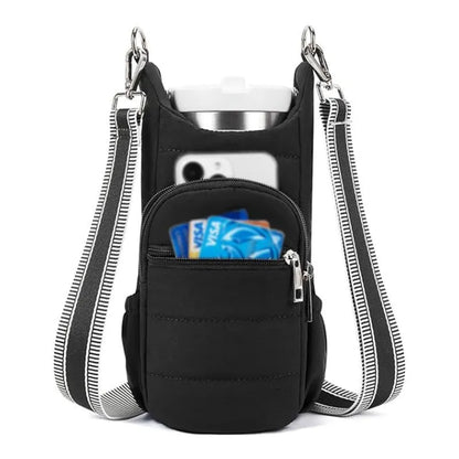 Black cloth water bottle carrier bag mounted on bicycle handlebars