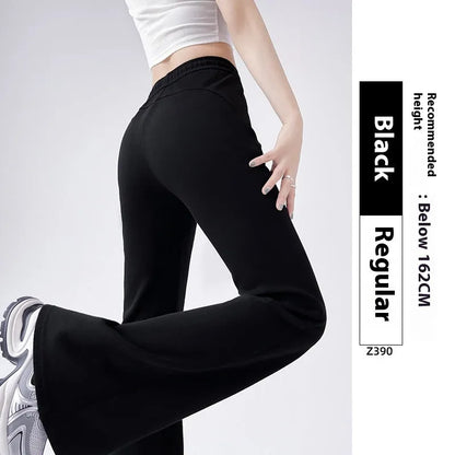 Women's high waist bootcut sports pants in black cotton with fleece lining and micro elasticity, slightly flared leg.