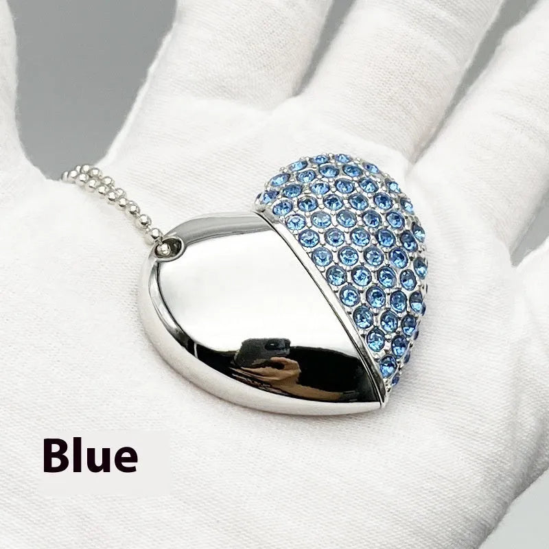 Blue heart-shaped USB flash drive with a brick-inlaid pattern on its metal surface.