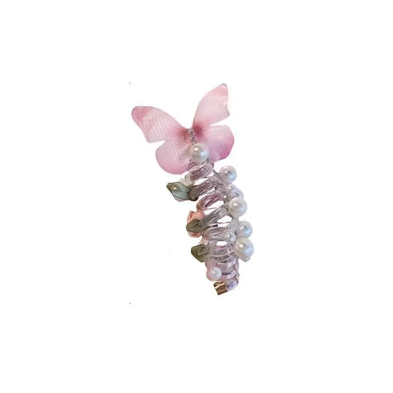 Colourful butterfly and pearl elastic hair band for children on a white background.