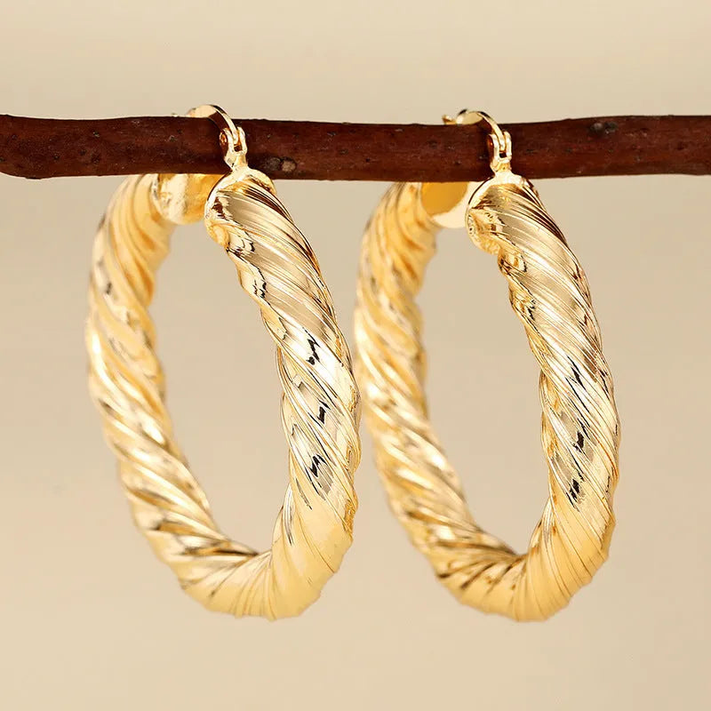 Geometric ring design ear clips for women with drop-shaped copper construction and electroplated finish