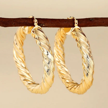 Geometric ring design ear clips for women with drop-shaped copper construction and electroplated finish