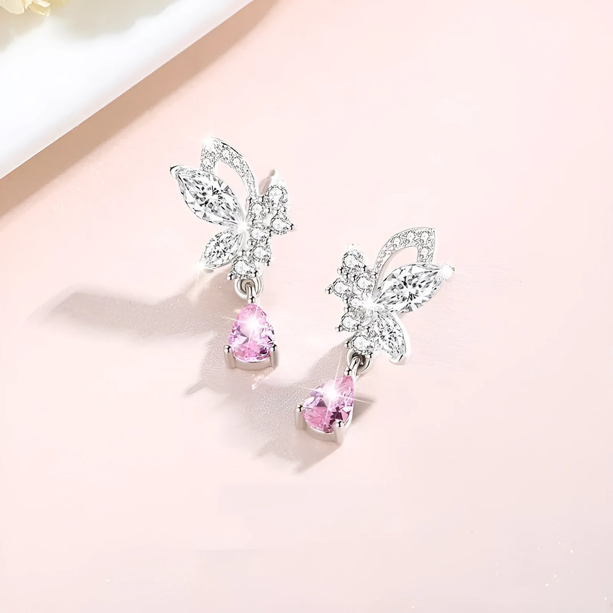 Butterfly shaped silver stud earrings with Swarovski crystal details on wings