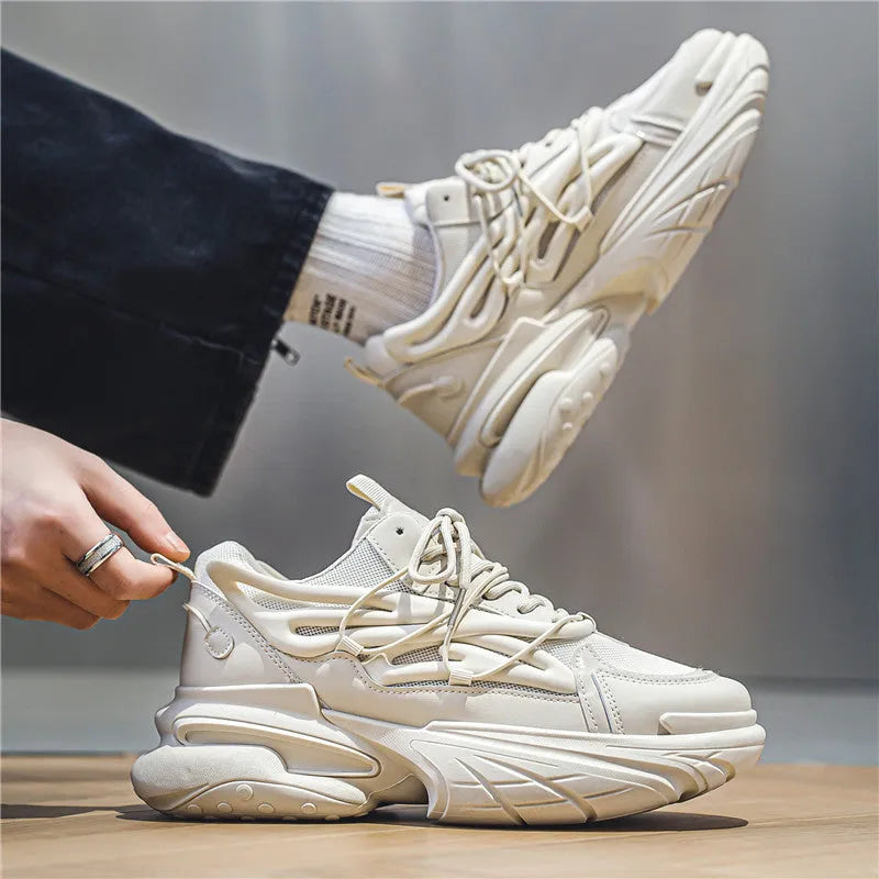 Men's low-top lace-up sneakers in mesh and PU leather with rubber sole, shown in beige and black colours.