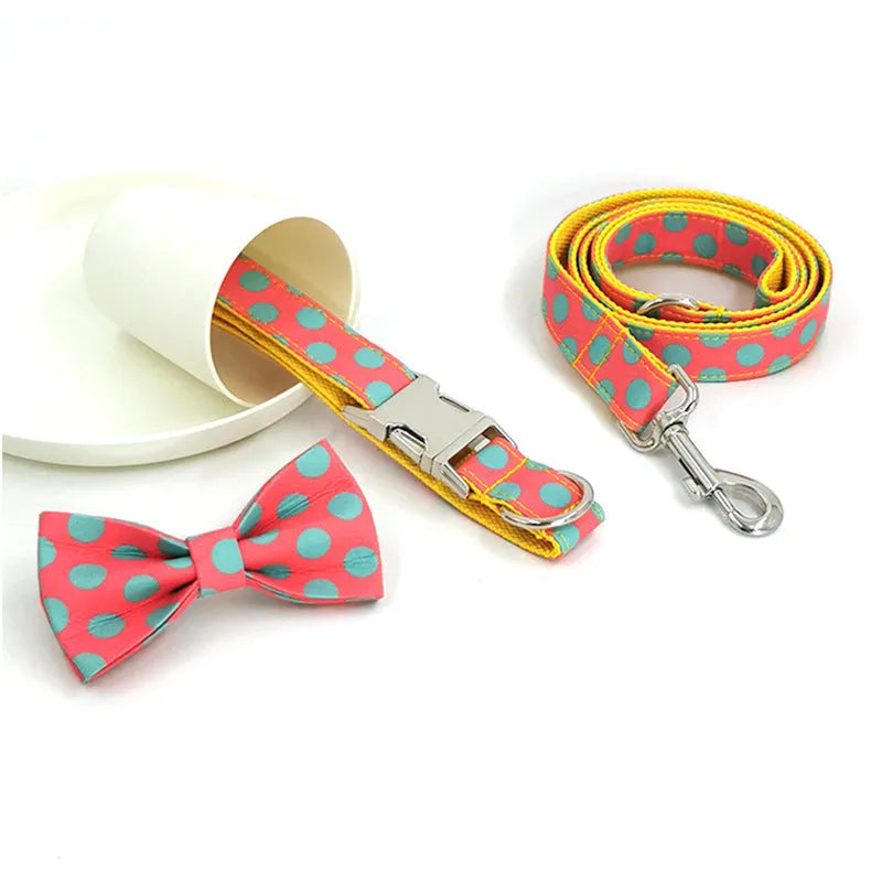 Yellow polka dot dog collar and lead set with coordinating bow, available in five sizes