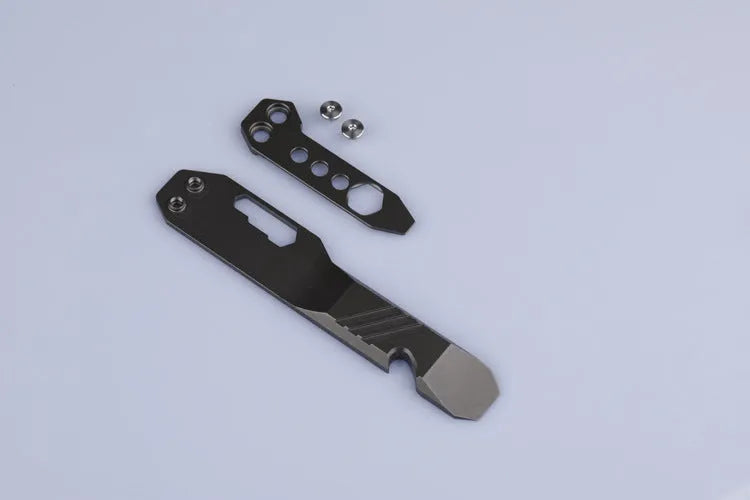 Titanium alloy multi-function crowbar tool with bottle opener on a stone wash finish background.