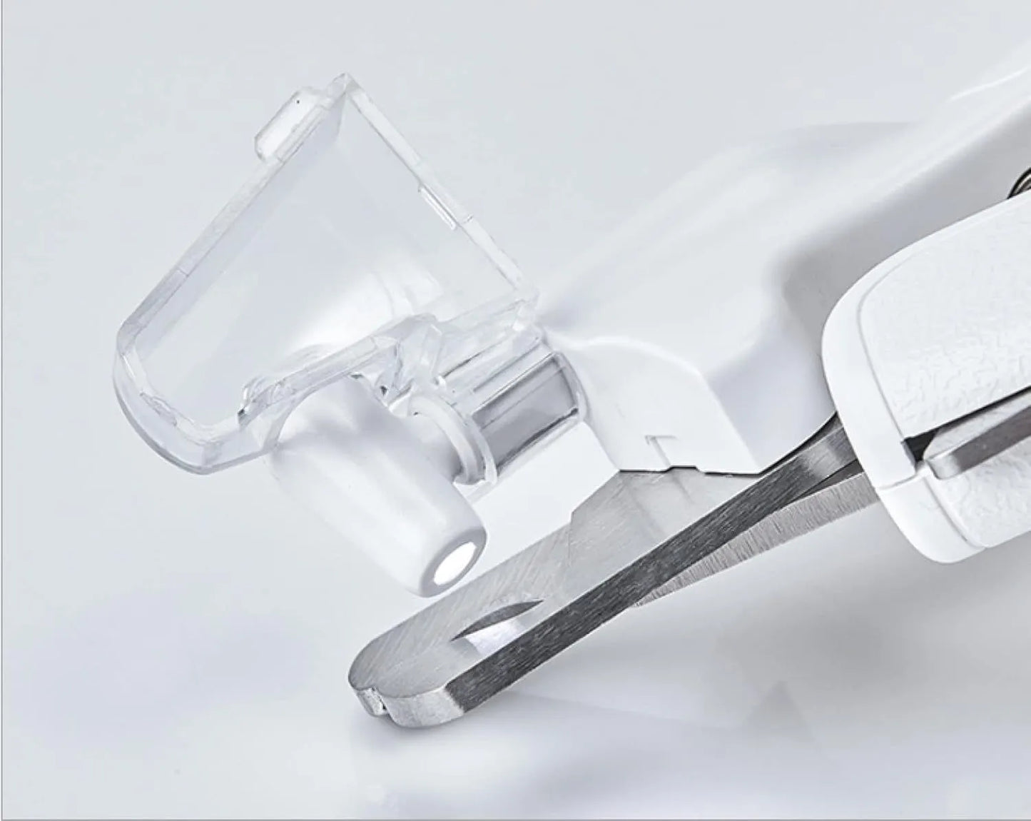White LED pet nail clippers with a transparent safety guard and a nail file on a grey background.