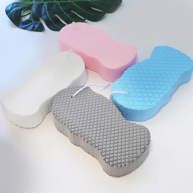 3D fish scale pattern bath sponge in white, grey, pink, or light blue for gentle exfoliation