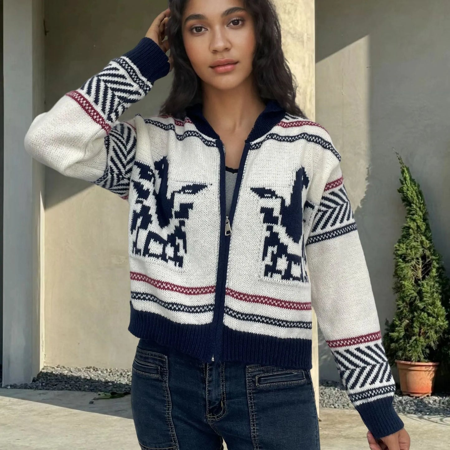 White women's wool zipper cardigan with contrasting jacquard stripe pattern on the front.