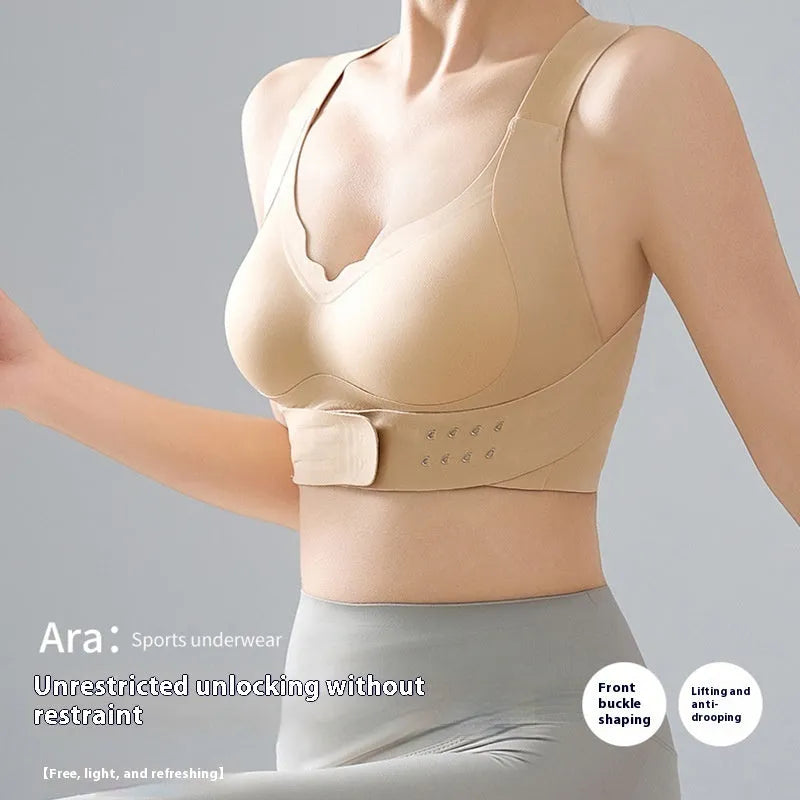 Front buckle closure on a black women's yoga bra with fixed double shoulder straps and a 3/4 cup.