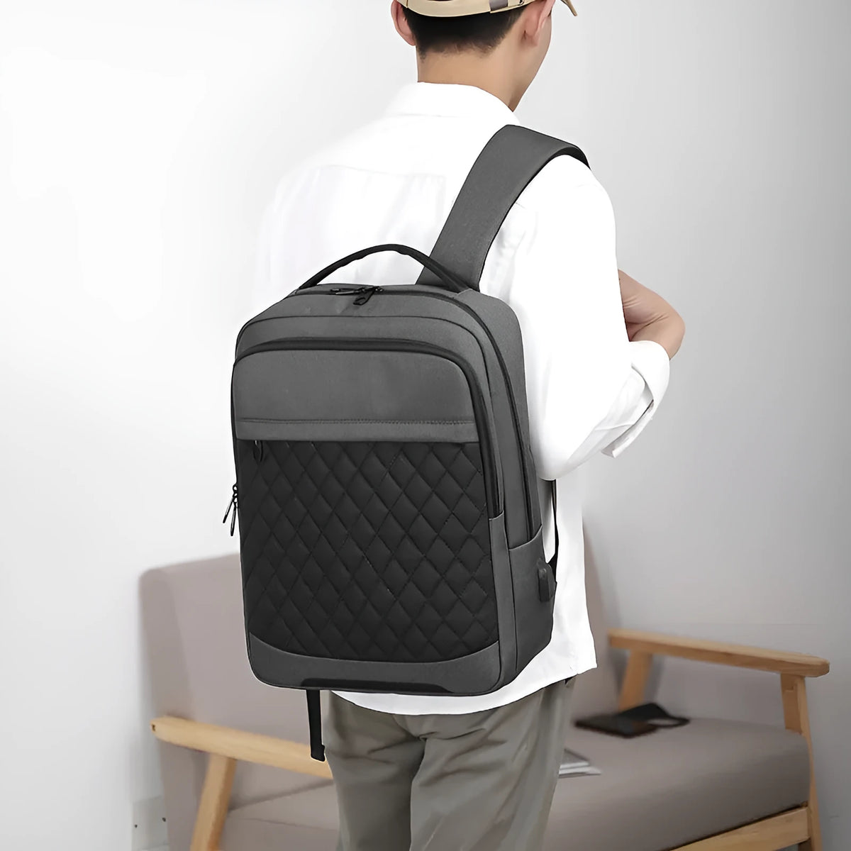 Men's Oxford cloth travel backpack with curved shoulder straps and diamond mesh panels in black colour