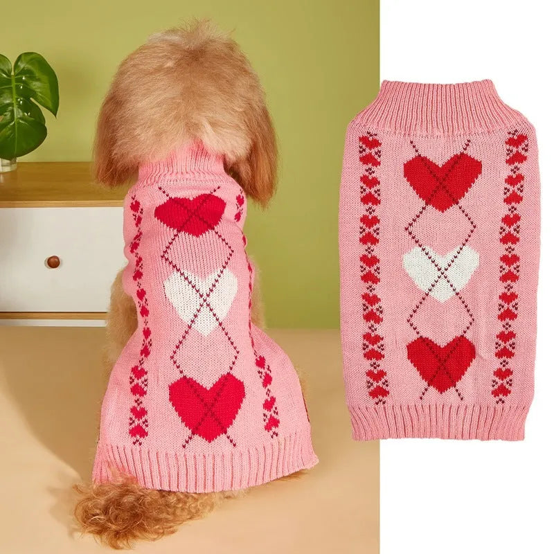 Dog wearing red love heart design sweater with bow decoration