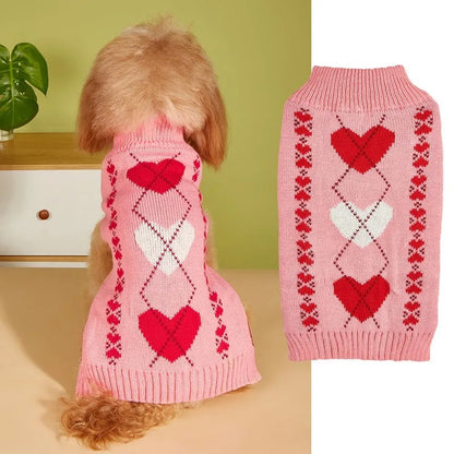 Dog wearing red love heart design sweater with bow decoration