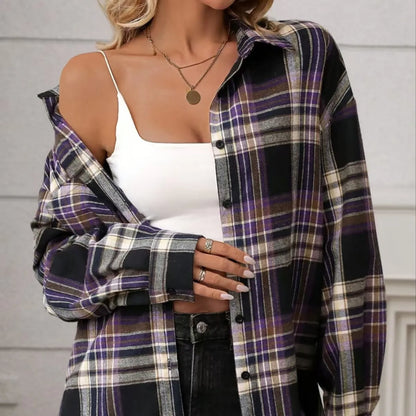 Woman wearing a loose-fit black and white plaid long sleeve shirt made from 100% cotton.