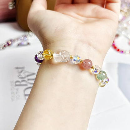 Close-up of a handmade crystal bracelet with a detailed nine-tailed fox design on a wrist.