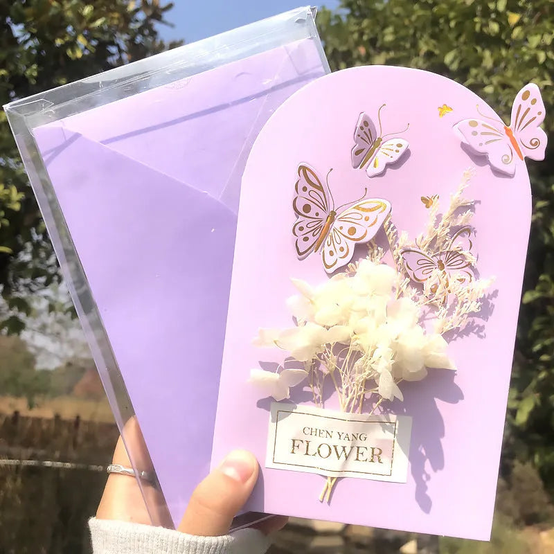Handmade 3D butterfly greeting card with stand-up artificial flowers on coated paper, 16x10.5cm