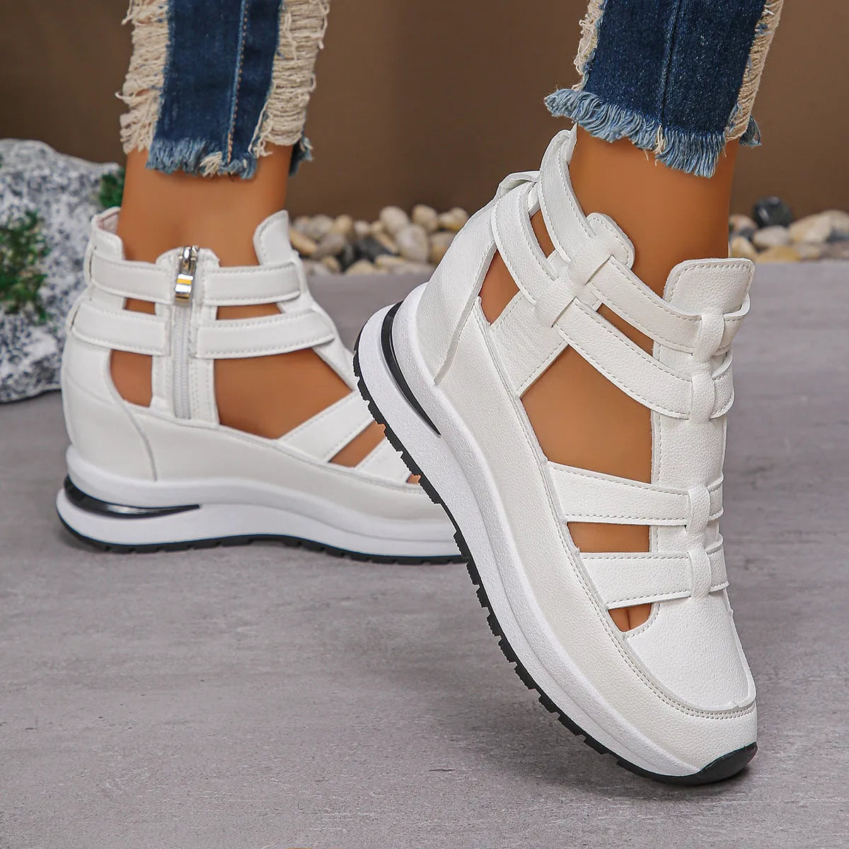 Black women's close-toed platform sandals with hollow-out design and Velcro strap.