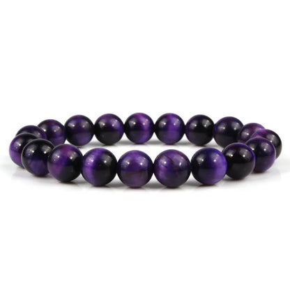 Natural tiger eye crystal bead bracelet showing round geometric beads on a wrist, available in multiple sizes and colour variations.