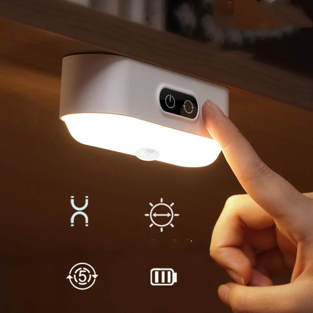 White magnetic USB rechargeable LED night light with touch controls, shown attached to a metal surface.